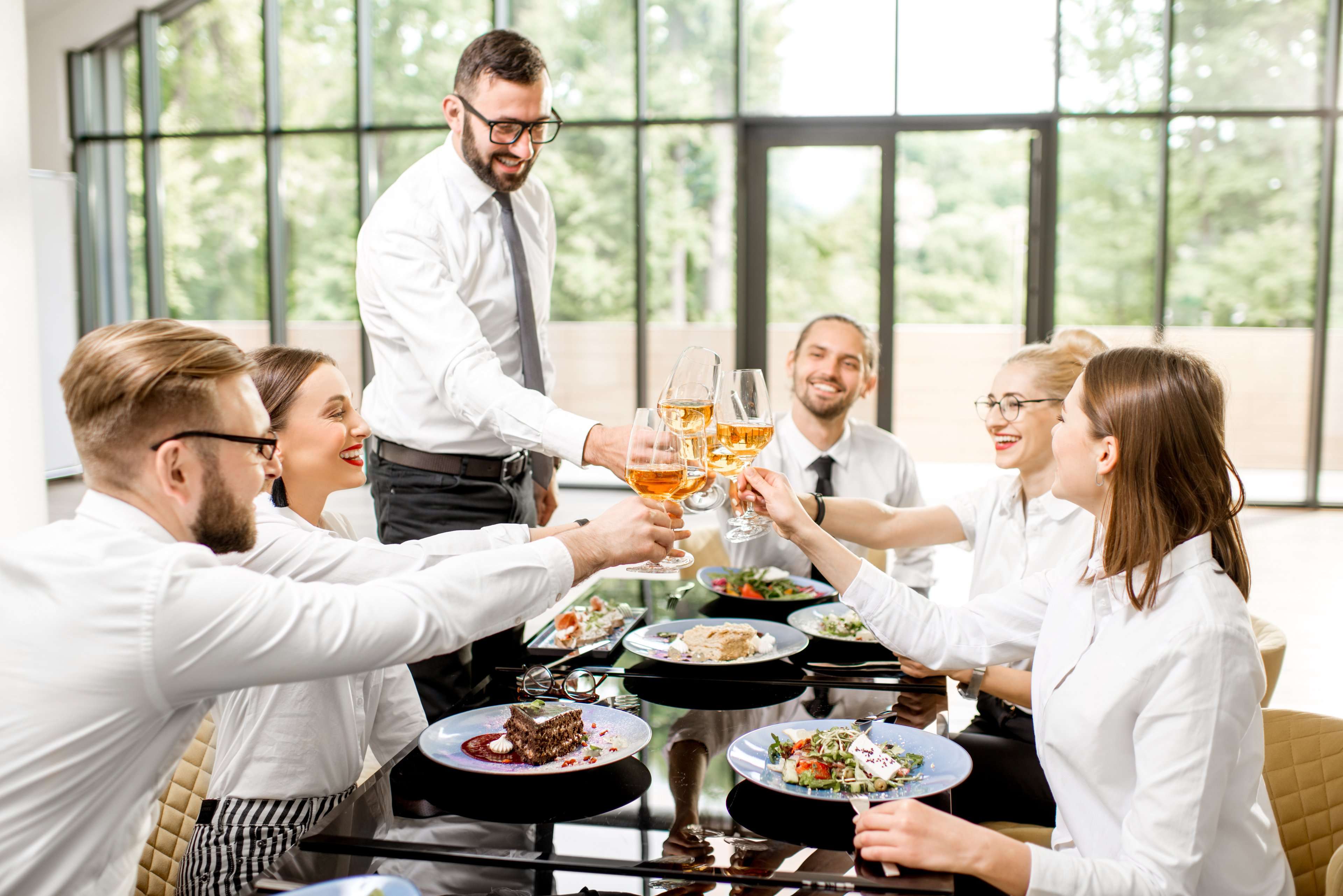 Team celebrating over lunch