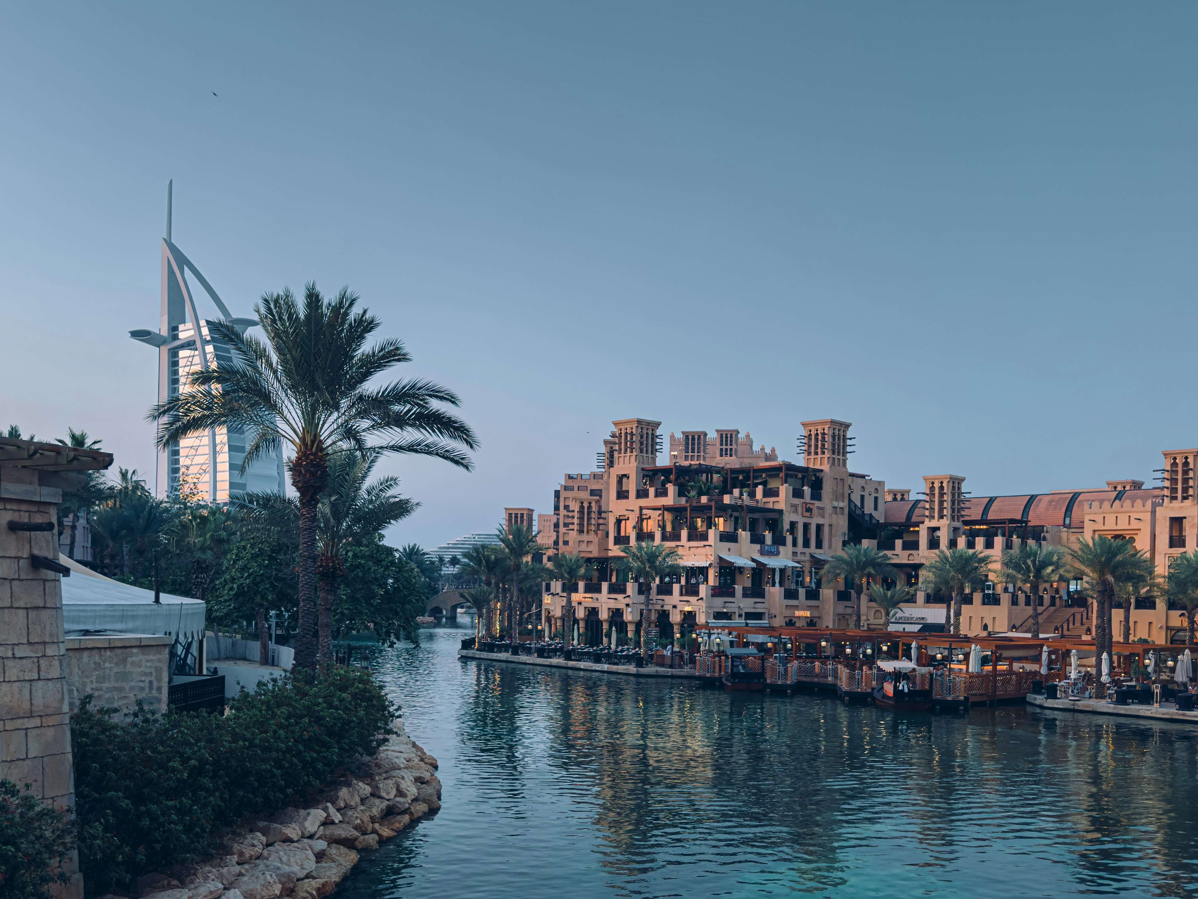 Burj Al Arab beyond palm-lined Madinat Jumeirah waterways